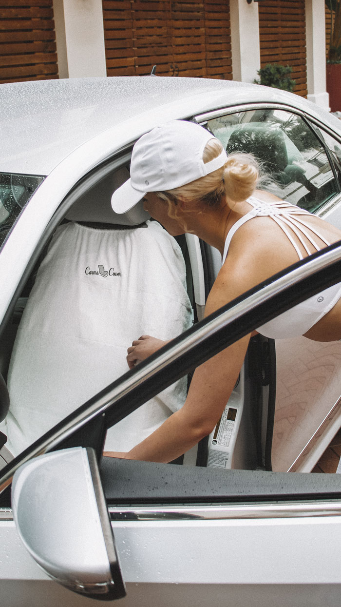 A woman wearing a white color inner wear and a cap